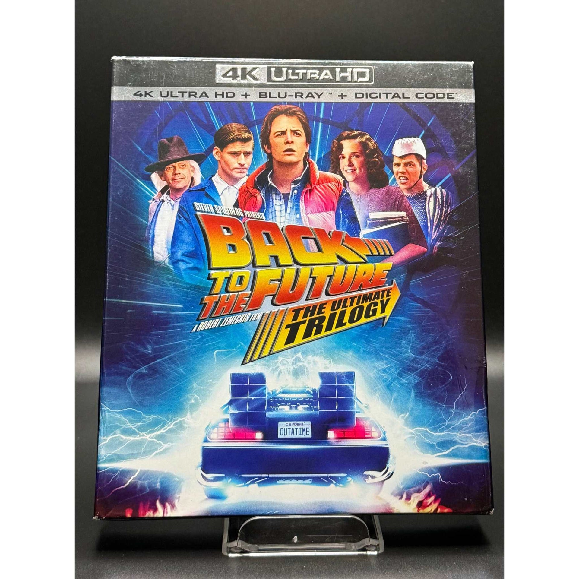 Back to the Future: The Ultimate Trilogy 4K Ultra HD + Blu-Ray set with vibrant cover art featuring characters and DeLorean.