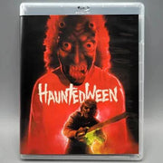 Vinegar Syndrome Blu-Ray cover featuring "Hauntedween" with a man and chainsaw against a fiery red backdrop.